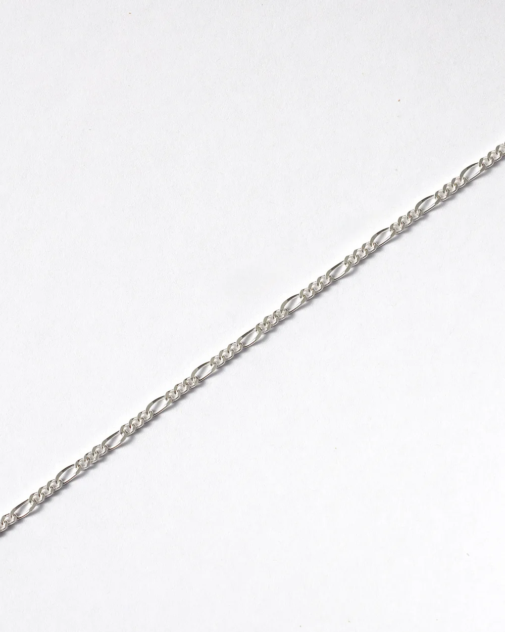 Silver chain jewelry on white background