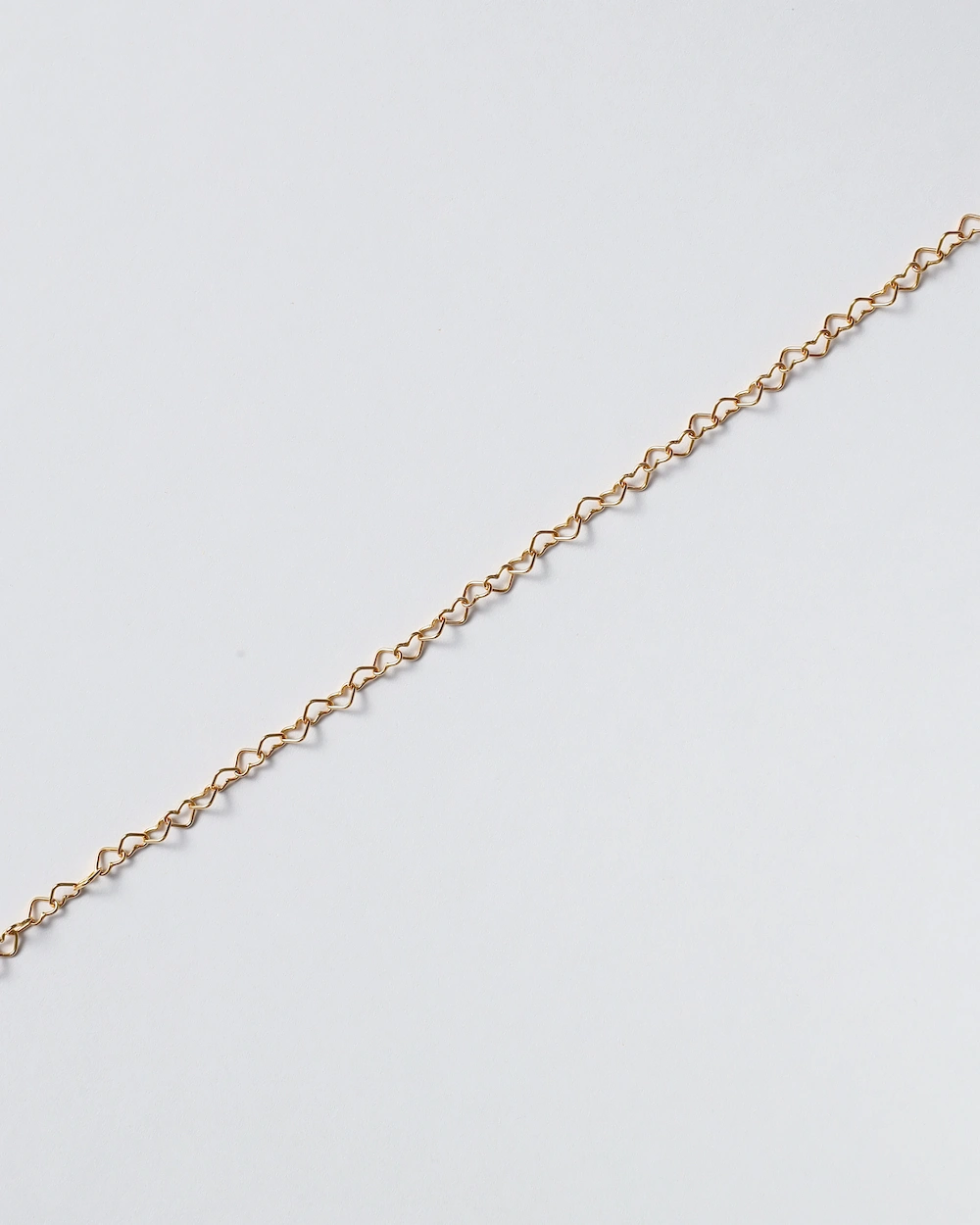 Gold chain on white background