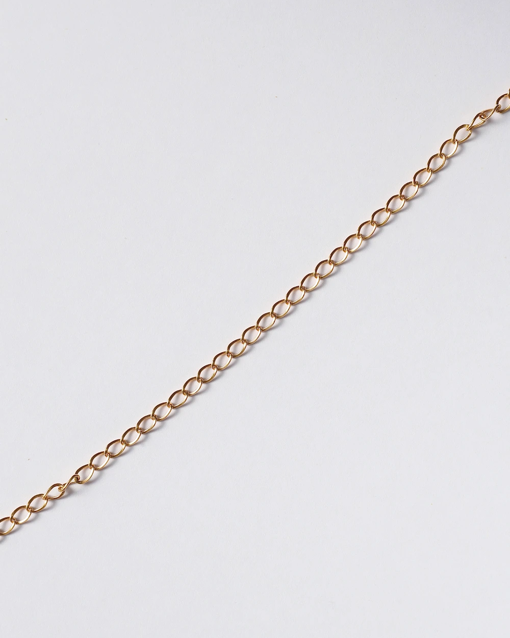 Gold chain on white background